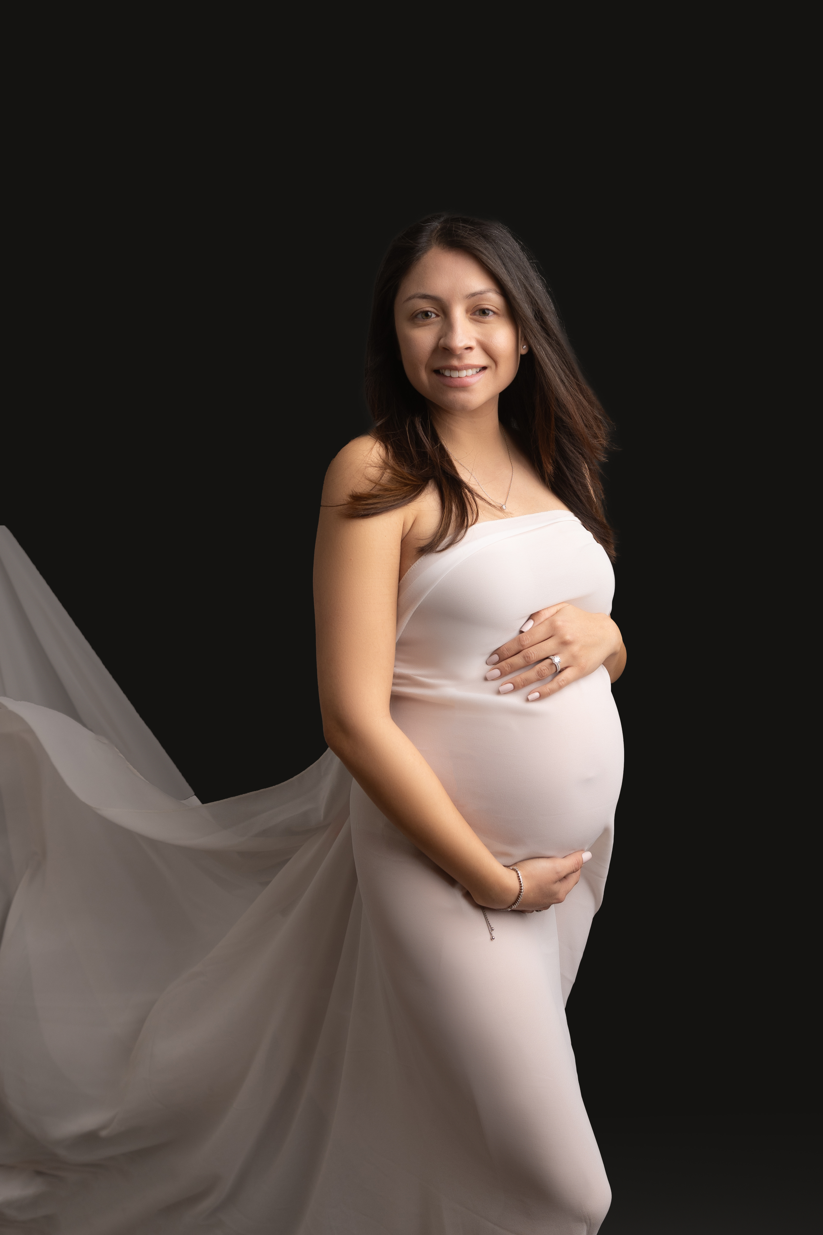 pregnant mother poses in white silk 