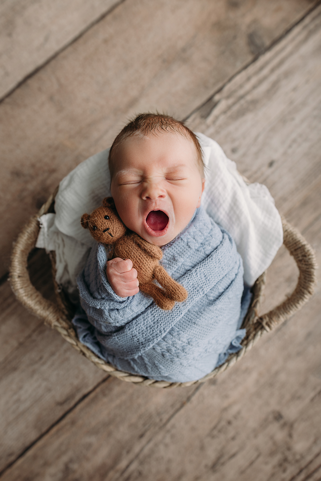 baby boy yawn during newborn photos in Tampa