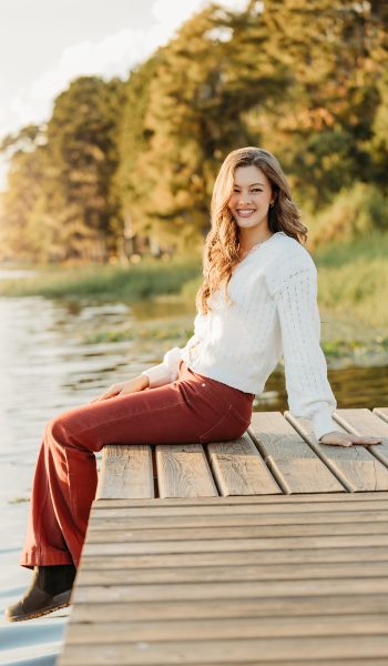 high school senior girl poses for her session by tampa senior photographer