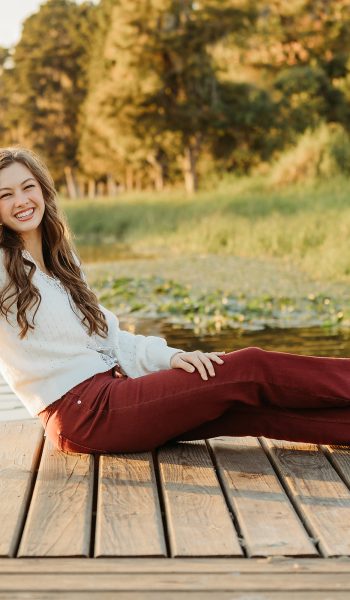 high school senior girl poses for her session by tampa senior photographer
