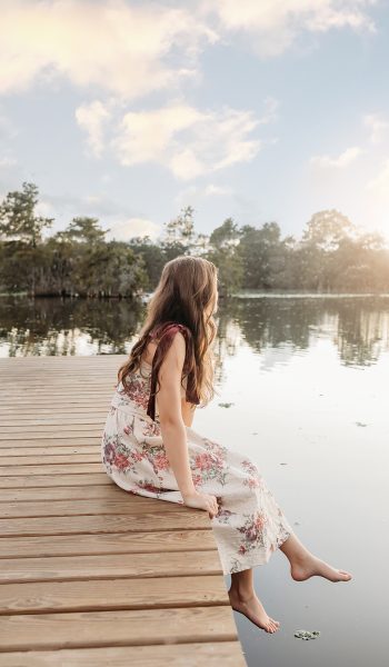 high school senior girl poses for her session by tampa senior photographer