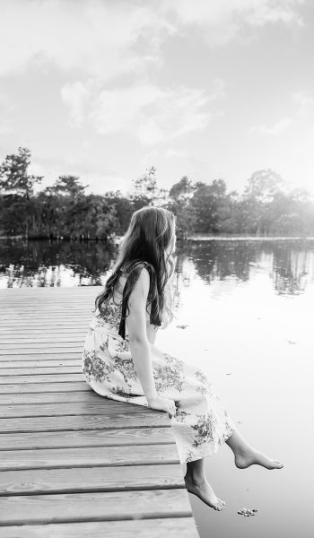 high school senior girl poses for her session by tampa senior photographer