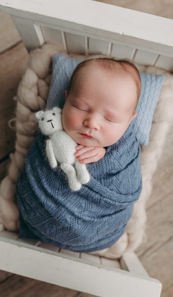 Sleeping baby with stuffed toy